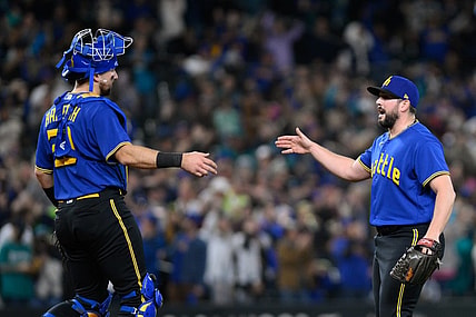 Sep 29, 2023; Seattle, Washington, USA; Seattle Mariners catcher Cal Raleigh (29) and relief pitcher Dominic Leone (54) celebrate defeating the Texas Rangers at T-Mobile Park. Mandatory Credit: Steven Bisig-USA TODAY Sports