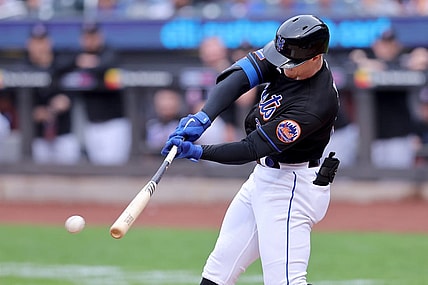 Sep 30, 2023; New York City, New York, USA; New York Mets designated hitter Brett Baty (22) hits an RBI single against the Philadelphia Phillies during the first inning at Citi Field. Mandatory Credit: Brad Penner-USA TODAY Sports