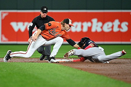 Sep 30, 2023; Baltimore, Maryland, USA; Baltimore Orioles third baseman Gunnar Henderson (2) tags Boston Red Sox designated hitter Justin Turner (2) out on a third inning steal attempt at Oriole Park at Camden Yards. Mandatory Credit: Tommy Gilligan-USA TODAY Sports