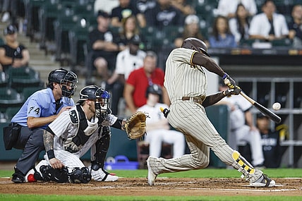 Sep 30, 2023; Chicago, Illinois, USA; San Diego Padres left fielder Juan Soto (22) hits an RBI-double against the Chicago White Sox during the second inning at Guaranteed Rate Field. Mandatory Credit: Kamil Krzaczynski-USA TODAY Sports