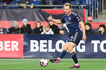 Mar 18, 2023; Foxborough, Massachusetts, USA; New England Revolution defender Henry Kessler (4) kicks the ball against the Nashville SC during the first half at Gillette Stadium. Mandatory Credit: Brian Fluharty-USA TODAY Sports