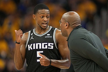 Apr 23, 2023; San Francisco, California, USA; Sacramento Kings guard De'Aaron Fox (5) talks to head coach Mike Brown during the second quarter of game four of the 2023 NBA playoffs against the Golden State Warriors at Chase Center. Mandatory Credit: Darren Yamashita-USA TODAY Sports