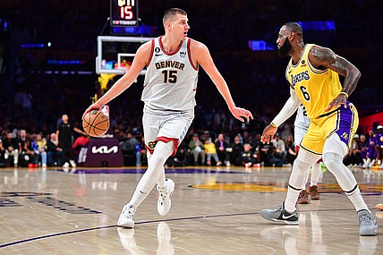 May 22, 2023; Los Angeles, California, USA; Denver Nuggets center Nikola Jokic (15) drives to the basket against Los Angeles Lakers forward LeBron James (6) during the second quarter in game four of the Western Conference Finals for the 2023 NBA playoffs at Crypto.com Arena. Mandatory Credit: Gary A. Vasquez-USA TODAY Sports