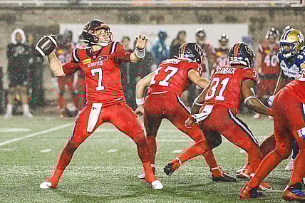 Jul 1, 2023; Montreal, Quebec, CAN; Montreal Alouettes quarterback Cody Fajardo (7) passes the ball against the Winnipeg Blue Bombers during the fourth quarter at Percival Molson Memorial Stadium. Mandatory Credit: David Kirouac-USA TODAY Sports