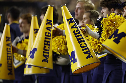 Sep 16, 2023; Ann Arbor, Michigan, USA;  Michigan Wolverines cheerleader megaphone during the first half against the Bowling Green Falcons at Michigan Stadium. Mandatory Credit: Rick Osentoski-USA TODAY Sports