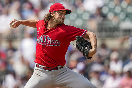 Sep 20, 2023; Cumberland, Georgia, USA; Philadelphia Phillies starting pitcher Aaron Nola (27) pitches against the Atlanta Braves during the first inning  at Truist Park. Mandatory Credit: Dale Zanine-USA TODAY Sports