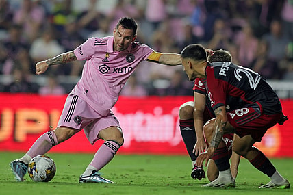Sep 20, 2023; Fort Lauderdale, Florida, USA; Inter Miami forward Lionel Messi (10) kicks the ball past Toronto FC during the first half at DRV PNK Stadium. Mandatory Credit: Sam Navarro-USA TODAY Sports