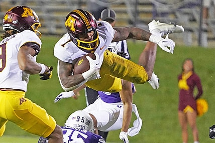 Sep 23, 2023; Evanston, Illinois, USA; Minnesota Golden Gophers running back Darius Taylor (1) leaps over Northwestern Wildcats linebacker Kenny Soares Jr. (35) during the second half at Ryan Field. Mandatory Credit: David Banks-USA TODAY Sports