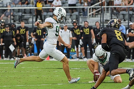 Sep 30, 2023; Orlando, Florida, USA; Baylor Bears kicker Isaiah Hankins (98) kicks a field goal to take the lead 36-35 during the fourth quarter at FBC Mortgage Stadium. Mandatory Credit: Mike Watters-USA TODAY Sports