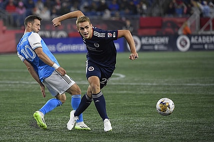 Sep 30, 2023; Foxborough, Massachusetts, USA;  Charlotte FC midfielder Brecht Dejaegere (10) and New England Revolution midfielder Noel Buck (29) battle for the ball during the first half at Gillette Stadium. Mandatory Credit: Bob DeChiara-USA TODAY Sports