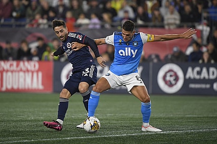 Sep 30, 2023; Foxborough, Massachusetts, USA;  New England Revolution midfielder Nacho Gil (23) and Charlotte FC midfielder Ashley Westwood (8) battle for the ball during the first half at Gillette Stadium. Mandatory Credit: Bob DeChiara-USA TODAY Sports