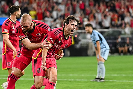 Sep 30, 2023; St. Louis, Missouri, USA; St. Louis City midfielder Jared Stroud (8) celebrates with forward Joao Klauss (9)scoring a goal against Sporting Kansas City during the second half at CITYPARK. Mandatory Credit: Joe Puetz-USA TODAY Sports