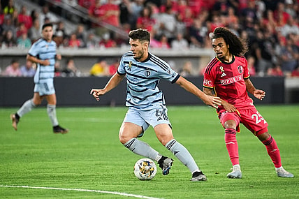 Sep 30, 2023; St. Louis, Missouri, USA; Sporting Kansas City midfielder Nemanja Radoja (6) shields the ball from St. Louis City midfielder Aziel Jackson (25) during the second half at CITYPARK. Mandatory Credit: Joe Puetz-USA TODAY Sports