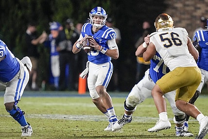 Sep 30, 2023; Durham, North Carolina, USA;Duke Blue Devils quarterback Riley Leonard (13) looks for a receiver  during the second half against the Notre Dame Fighting Irish at Wallace Wade Stadium. Mandatory Credit: Jim Dedmon-USA TODAY Sports