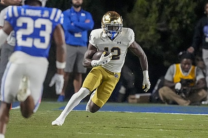 Sep 30, 2023; Durham, North Carolina, USA; Notre Dame Fighting Irish running back Jeremiyah Love (12) runs for yards after catch against the Duke Blue Devils during the second half at Wallace Wade Stadium. Mandatory Credit: Jim Dedmon-USA TODAY Sports