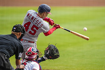 Oct 1, 2023; Cumberland, Georgia, USA; Washington Nationals first baseman Joey Meneses (45) hits a double to drive in a run against the Atlanta Braves during the first inning at Truist Park. Mandatory Credit: Dale Zanine-USA TODAY Sports