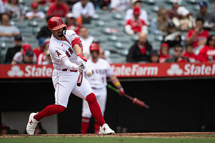 Oct 1, 2023; Anaheim, California, USA; Los Angeles Angels left fielder Randal Grichuk (15) hits a home run against the Oakland Athletics during the third inning at Angel Stadium. Mandatory Credit: Jonathan Hui-USA TODAY Sports