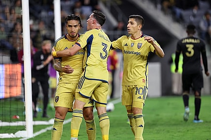 Oct 1, 2023; Los Angeles, California, USA;  Real Salt Lake forward Cristian Arango (9) celebrates with defender Bryan Oviedo (3) and forward Jefferson Savarino (10) after scoring a goal during the second half against the Los Angeles FC at BMO Stadium. Mandatory Credit: Kiyoshi Mio-USA TODAY Sports