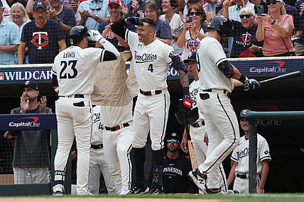 Oct 3, 2023; Minneapolis, Minnesota, USA; Minnesota Twins short stop Royce Lewis (23) celebrates with shortstop Carlos Correa after hitting a home run in the third inning against the Toronto Blue Jays during game one of the Wildcard series for the 2023 MLB playoffs at Target Field. Mandatory Credit: Jesse Johnson-USA TODAY Sports