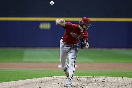 Oct 4, 2023; Milwaukee, Wisconsin, USA; Arizona Diamondbacks starting pitcher Zac Gallen (23) pitches against the Milwaukee Brewers in the first inning during game two of the Wildcard series for the 2023 MLB playoffs at American Family Field. Mandatory Credit: Kamil Krzaczynski-USA TODAY Sports