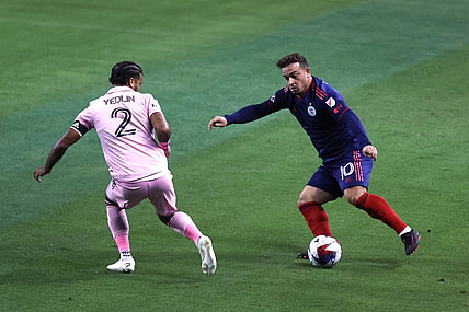 Oct 4, 2023; Chicago, Illinois, USA; Chicago Fire midfielder Xherdan Shaqiri (10) controls the ball during the first half while defended by Inter Miami CF defender DeAndre Yedlin (2) at Soldier Field. Mandatory Credit: Jon Durr-USA TODAY Sports