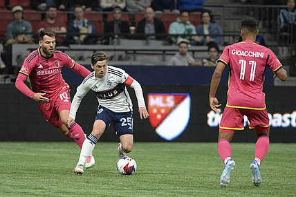 Oct 4, 2023; Vancouver, British Columbia, CAN;  Vancouver Whitecaps FC midfielder Ryan Gauld (25) controls the ball against St. Louis City SC midfielder Eduard Lowen (10) during the first half at BC Place. Mandatory Credit: Anne-Marie Sorvin-USA TODAY Sports