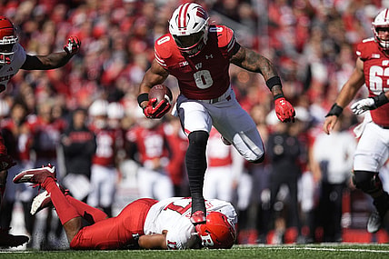 Oct 7, 2023; Madison, Wisconsin, USA;  Wisconsin Badgers running back Braelon Allen (0) rushes for a touchdown during the second quarter against the Rutgers Scarlet Knights at Camp Randall Stadium. Mandatory Credit: Jeff Hanisch-USA TODAY Sports