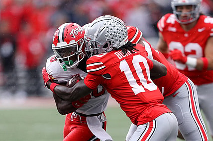 Oct 7, 2023; Columbus, Ohio, USA;  Maryland Terrapins wide receiver Tai Felton (10) runs the ball as Ohio State Buckeyes cornerback Denzel Burke (10) makes the tackle during the second quarter at Ohio Stadium. Mandatory Credit: Joseph Maiorana-USA TODAY Sports