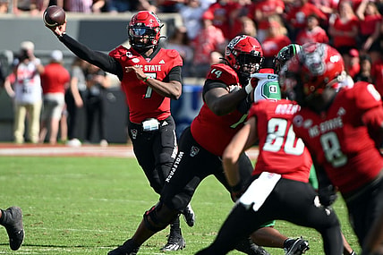 Oct 7, 2023; Raleigh, North Carolina, USA; North Carolina State Wolfpack quarterback MJ Morris (7) throws a pass during the first half against the Marshall Thundering Herd at Carter-Finley Stadium. Mandatory Credit: Rob Kinnan-USA TODAY Sports