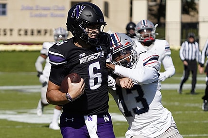 Oct 7, 2023; Evanston, Illinois, USA; Northwestern Wildcats quarterback Brendan Sullivan (6) runs for a touchdown as Howard Bison defensive back Jabari Knighten (13) defends him during the first half at Ryan Field. Mandatory Credit: David Banks-USA TODAY Sports
