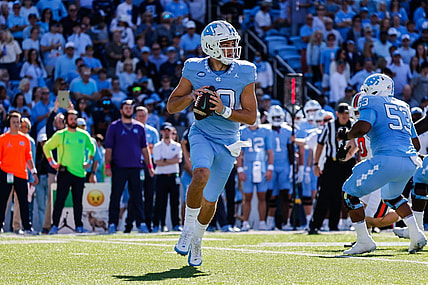 Oct 7, 2023; Chapel Hill, North Carolina, USA; North Carolina Tar Heels quarterback Drake Maye (10) runs the ball during the first half of the game against the Syracuse Orange at Kenan Memorial Stadium. Mandatory Credit: Jaylynn Nash-USA TODAY Sports