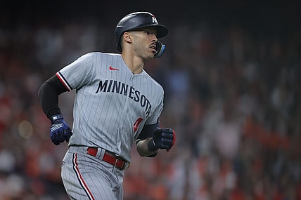Oct 7, 2023; Houston, Texas, USA; Minnesota Twins shortstop Carlos Correa (4) hits a double in the eighth inning against the Houston Astros during game one of the ALDS for the 2023 MLB playoffs at Minute Maid Park. Mandatory Credit: Erik Williams-USA TODAY Sports