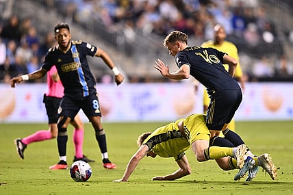 Oct 7, 2023; Philadelphia, Pennsylvania, USA; Philadelphia Union midfielder Jack McGlynn (16) and Nashville SC midfielder Dax McCarty (6) battle for position in the first half at Subaru Park. Mandatory Credit: Kyle Ross-USA TODAY Sports