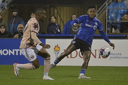 Oct 7, 2023; Montreal, Quebec, CAN; CF Montreal forward Romell Quioto (30) passes the ball against Portland Timbers defender Juan Mosquera (29) in the first half at Stade Saputo. Mandatory Credit: Eric Bolte-USA TODAY Sports