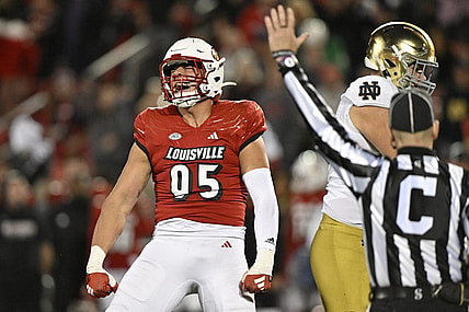 Oct 7, 2023; Louisville, Kentucky, USA;  Louisville Cardinals defensive lineman Mason Reiger (95) reacts after sacking Notre Dame Fighting Irish quarterback Sam Hartman (10) during the first half at L&N Federal Credit Union Stadium. Mandatory Credit: Jamie Rhodes-USA TODAY Sports