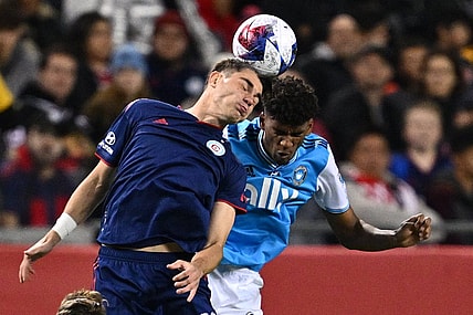 Oct 7, 2023; Chicago, Illinois, USA;  Chicago Fire FC forward Georgios Koutsias (19) and Charlotte FC defender Adilson Malanda (29) battle for control of the ball in the first half at Soldier Field. Mandatory Credit: Jamie Sabau-USA TODAY Sports