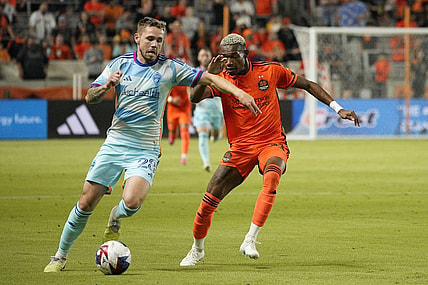 Oct 7, 2023; Houston, Texas, USA; Colorado Rapids midfielder Sam Nicholson (28) dribbles against Houston Dynamo forward Nelson Quinones (21) during the first half at Shell Energy Stadium. Mandatory Credit: Dustin Safranek-USA TODAY Sports