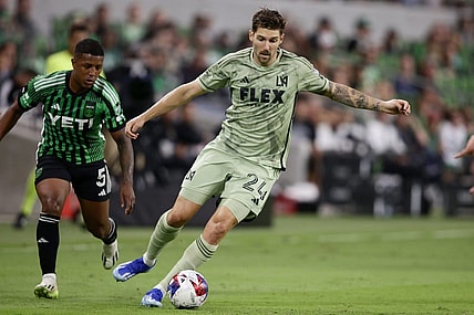 Oct 7, 2023; Austin, Texas, USA; Los Angeles FC midfielder Ryan Hollingshead (24) dribbles the ball during the first half at Q2 Stadium. Mandatory Credit: Erich Schlegel-USA TODAY Sports