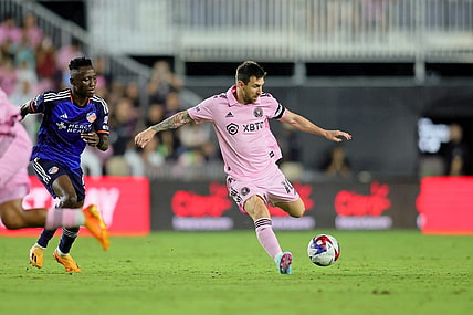 Oct 7, 2023; Fort Lauderdale, Florida, USA; Inter Miami CF forward Lionel Messi (10) dribbles the ball against FC Cincinnati midfielder Obinna Nwobodo (5) during the second half at DRV PNK Stadium. Mandatory Credit: Sam Navarro-USA TODAY Sports