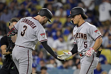 Oct 7, 2023; Los Angeles, California, USA; Arizona Diamondbacks center fielder Alek Thomas (5) reacts after hitting a home run against the Los Angeles Dodgers during the seventh inning for game one of the NLDS for the 2023 MLB playoffs at Dodger Stadium. Mandatory Credit: Jayne Kamin-Oncea-USA TODAY Sports