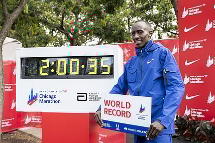 Oct 8, 2023; Chicago, IL, USA; Kelvin Kiptum (KEN) celebrates after finishing in a world record time of 2:00:35 to win the Chicago Marathon at Grant Park. Mandatory Credit: Patrick Gorski-USA TODAY Sports