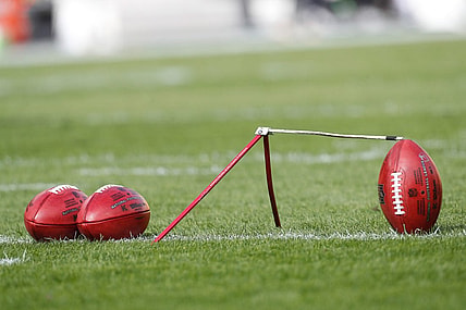 Oct 8, 2023; Pittsburgh, Pennsylvania, USA;  Official NFL game footballs and a kicking tee on the field before the Pittsburgh Steelers host the Baltimore Ravensa at Acrisure Stadium. Mandatory Credit: Charles LeClaire-USA TODAY Sports
