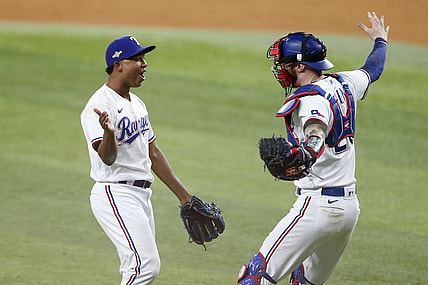 Oct 10, 2023; Arlington, Texas, USA; Texas Rangers relief pitcher Jose Leclerc (25) and catcher Jonah Heim (28) celebrate after defeating the Baltimore Orioles in game three of the ALDS for the 2023 MLB playoffs at Globe Life Field. Mandatory Credit: Andrew Dieb-USA TODAY Sports