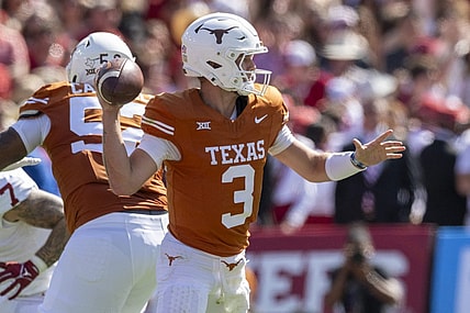 Oct 7, 2023; Dallas, Texas, USA; Texas Longhorns quarterback Quinn Ewers (3) in action during the game between the Texas Longhorns and the Oklahoma Sooners at the Cotton Bowl. Mandatory Credit: Jerome Miron-USA TODAY Sports