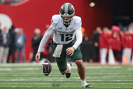 Oct 14, 2023; Piscataway, New Jersey, USA; Michigan State Spartans quarterback Katin Houser (12) recovers his own fumble for a first down during the first half against the Rutgers Scarlet Knights at SHI Stadium. Mandatory Credit: Vincent Carchietta-USA TODAY Sports
