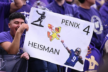Oct 14, 2023; Seattle, Washington, USA; Fans hold up a Michael Penix Jr. (9) (not pictured) sign during the second half of the game between the Washington Huskies and the Oregon Ducks at Alaska Airlines Field at Husky Stadium. Mandatory Credit: Steven Bisig-USA TODAY Sports