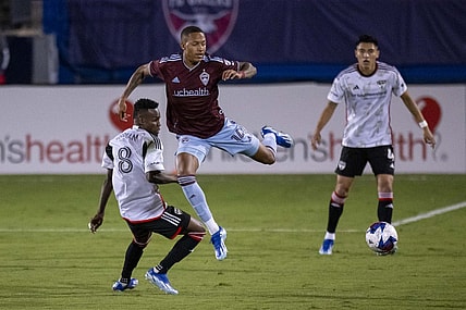 Oct 14, 2023; Frisco, TX, USA; Colorado Rapids forward Calvin Harris (14) leaps over FC Dallas forward Jader Obrian (8) during the first half at Toyota Stadium. Mandatory Credit: Jerome Miron-USA TODAY Sports