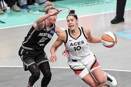 Oct 15, 2023; Brooklyn, New York, USA; Las Vegas Aces guard Kelsey Plum (10) drives around New York Liberty guard Courtney Vandersloot (22) in the first quarter during game three of the 2023 WNBA Finals at Barclays Center. Mandatory Credit: Wendell Cruz-USA TODAY Sports