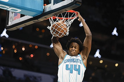 Oct 15, 2023; Charlotte, North Carolina, USA; Charlotte Hornets center Nick Richards Charlotte Hornets guard Frank Ntilikina (44) dunks against the Oklahoma City Thunder in the second half at Spectrum Center. Mandatory Credit: Nell Redmond-USA TODAY Sports