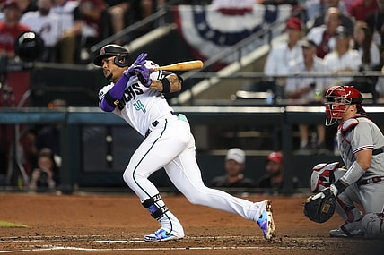 Arizona Diamondbacks second baseman Ketel Marte (4) hits double during the third inning against the Philadelphia Phillies in game three of the NLCS of the 2023 MLB playoffs at Chase Field in Phoenix on Oct. 19, 2023.